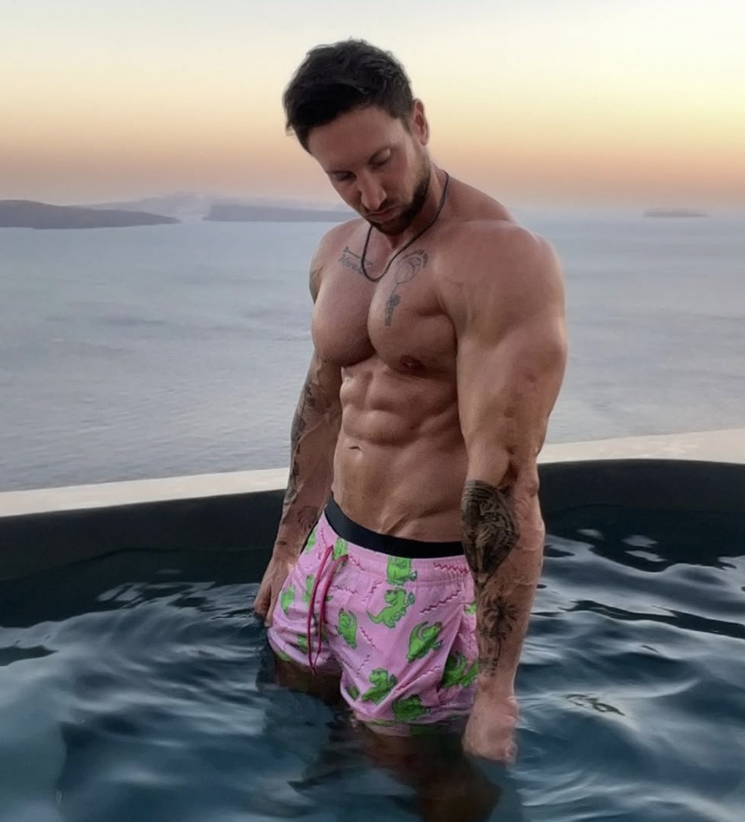 Troy Adashun in an infinity pool at dusk